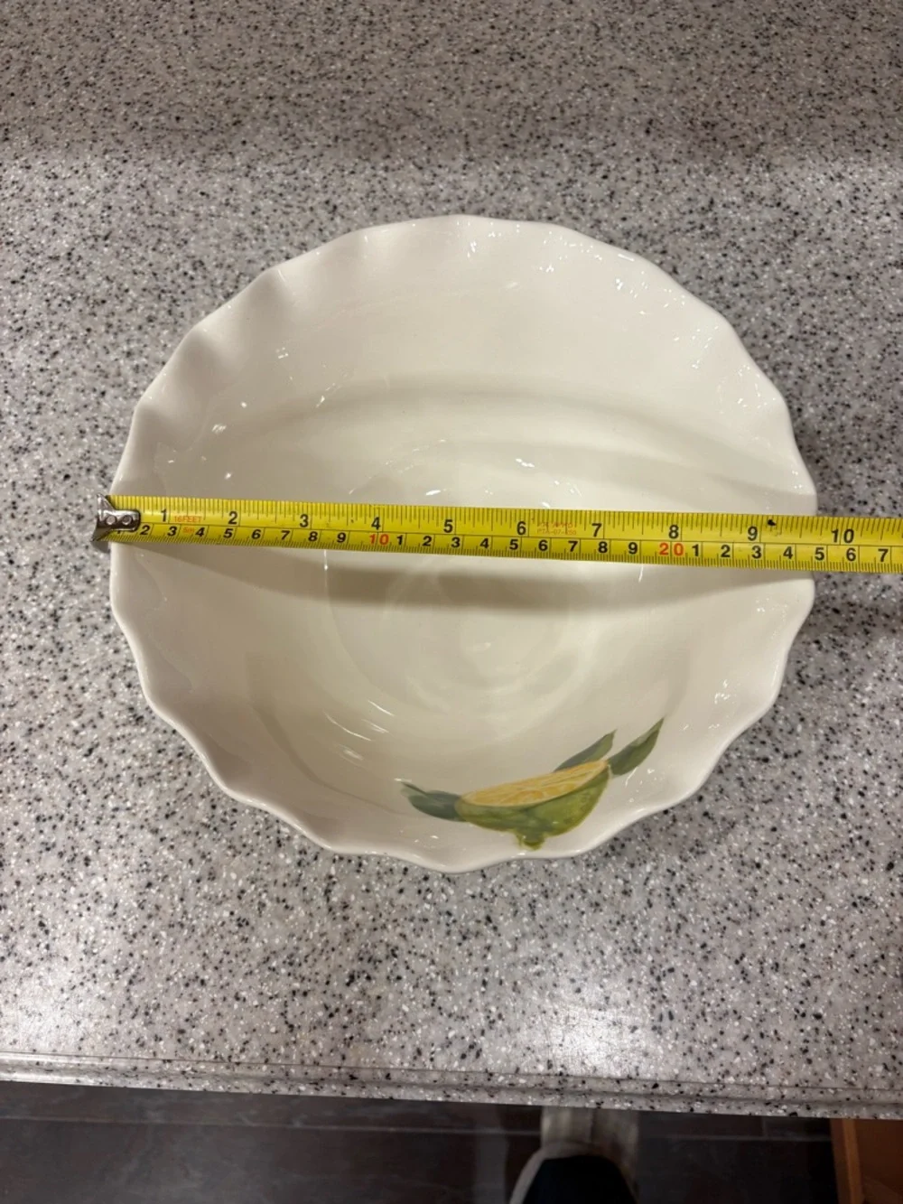 Hand-painted ceramic ruffle bowl featuring lemon motifs. Never Used. Display